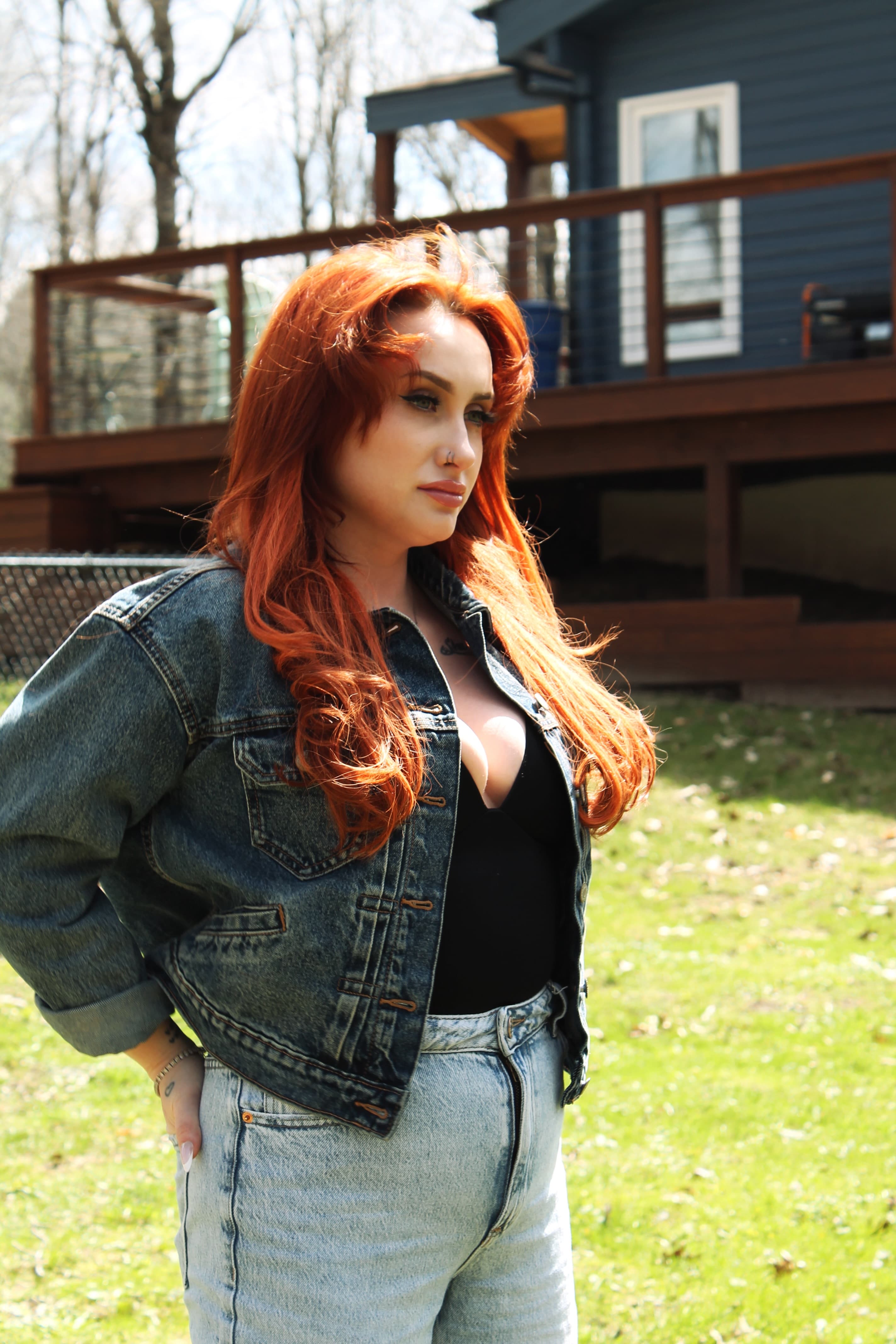 Sunlit outdoor portrait in denim with camera-ready natural glam